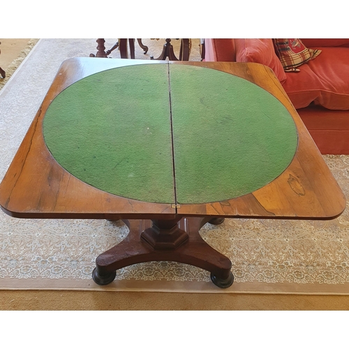 146 - An early 19th Century Rosewood Foldover Card Table on hexagonal shaft platform base and turned suppo... 