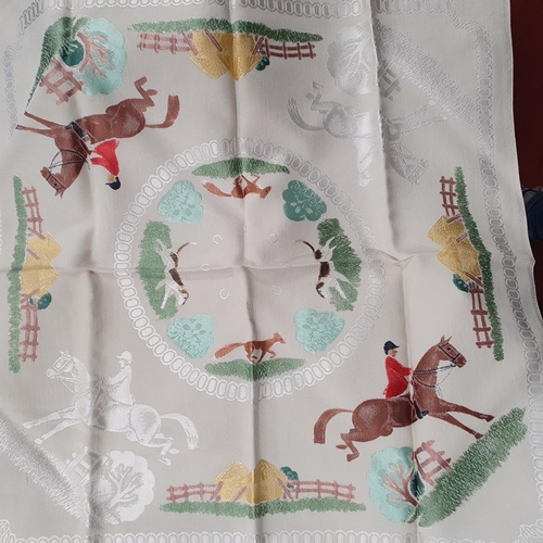 184 - A Large table cloth of Equestrian interest with 7 matching napkins .  L 210 x 180 cm approx.