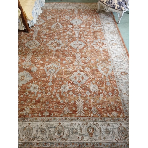 439 - A full pile Turkish Ziegler style Carpet with all over floral field in Terracotta and with a Cream b... 