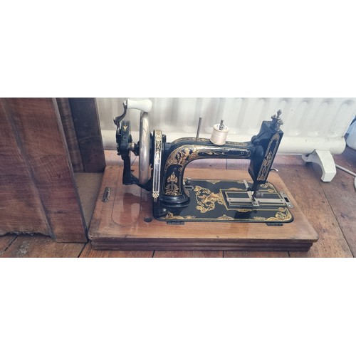 421 - A Vintage cased Stoewer sewing Machine in a Walnut Case. H 30 x W 40 x D 24 cm approx.