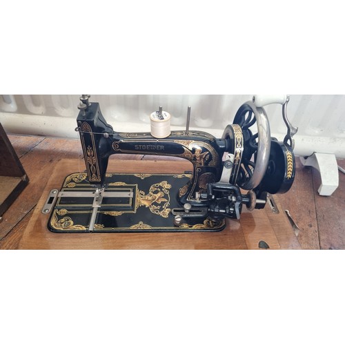 421 - A Vintage cased Stoewer sewing Machine in a Walnut Case. H 30 x W 40 x D 24 cm approx.