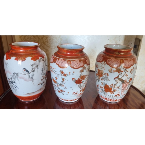 378 - A good set of three cream ground Oriental Vases with hand painted floral decoration and birds of par... 