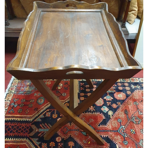 59 - A vintage Mahogany Butlers Tray on stand. 45 x 64 cm approx.