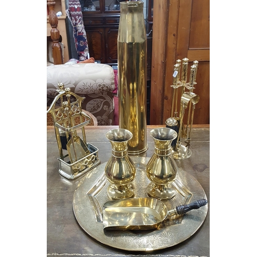 332 - A good quantity of Brassware to include a very large trench art shell, a stick stand, a pair of vase... 