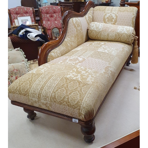 339 - A 19th Century Mahogany Chaise Longue with cream and gold patchwork style upholstery on turned suppo... 