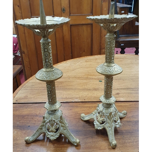 349 - A good pair of Brass pricket tripod Candlesticks each with a double knop stem supporting a pierced d... 