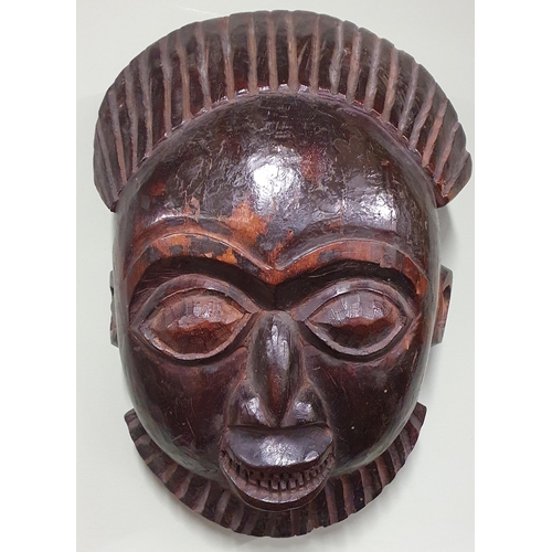 A good carved African tribal ceremonial Mask. 37 x 29 cm approx.