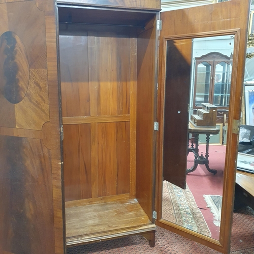 350 - An early 20th Century Mahogany two door Wardrobe the left door having a mirrored interior.
H 200 x W... 