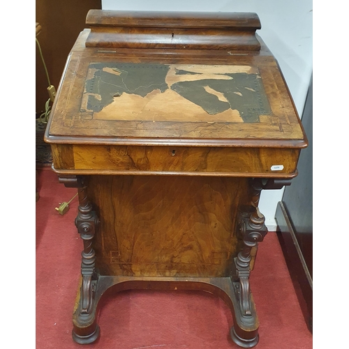 325 - A Victorian Walnut and Burr Walnut Davenport with four drawer side with lift up lid, fitted interior... 