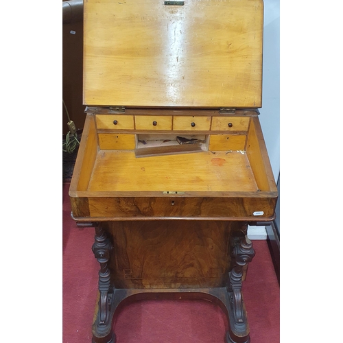 325 - A Victorian Walnut and Burr Walnut Davenport with four drawer side with lift up lid, fitted interior... 