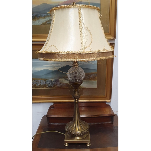 367 - A Brass and Glass effect Table Lamp with shade along with a crystal example. H 58 cm approx.