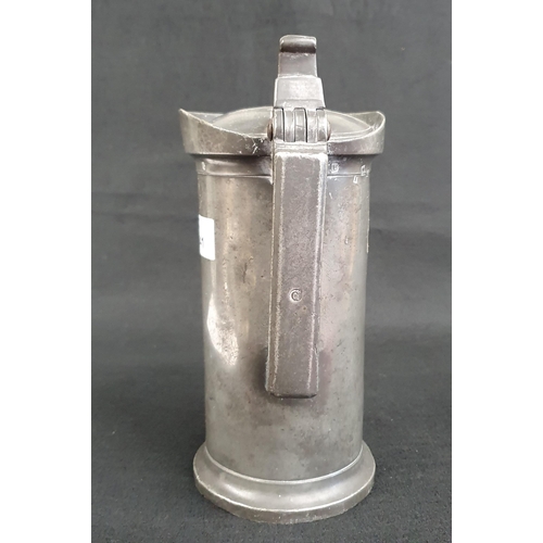 41 - A very good early Pewter Flagon with hinged cover, the base, collar, and handle with numerous hallma... 