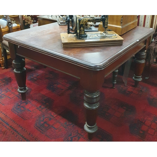 419 - A 19th Century Mahogany Dining Table of good quality on turned supports and brass casters, missing l... 