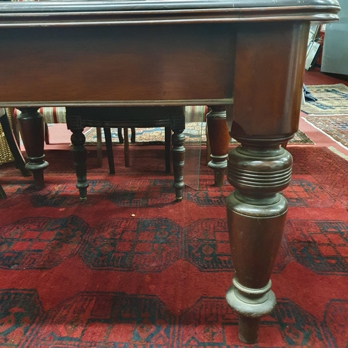 419 - A 19th Century Mahogany Dining Table of good quality on turned supports and brass casters, missing l... 