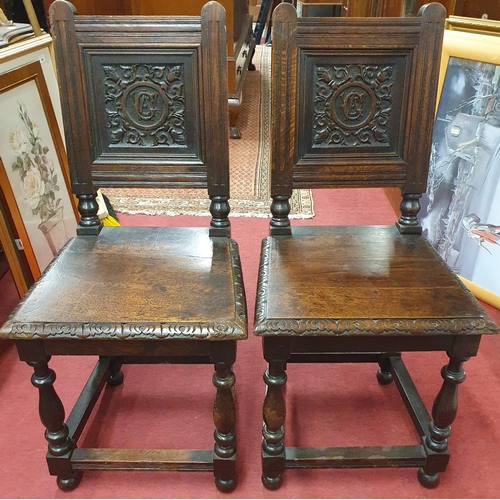 427 - A good pair of 19th Century Oak hall Chairs with armorial style carved back.
H 90 x W 42 x D 40 cm a... 