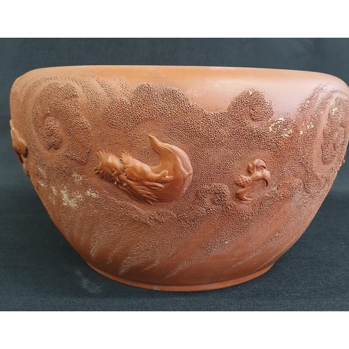 43 - A late 19th Century Chinese Terracotta dragon and phoenix Bowl. D 30 x H 12 cm approx.