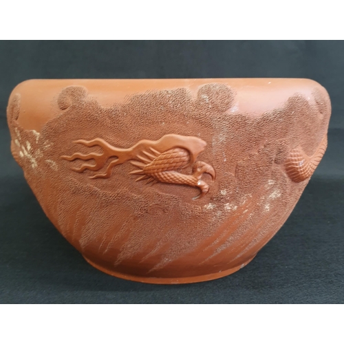 43 - A late 19th Century Chinese Terracotta dragon and phoenix Bowl. D 30 x H 12 cm approx.