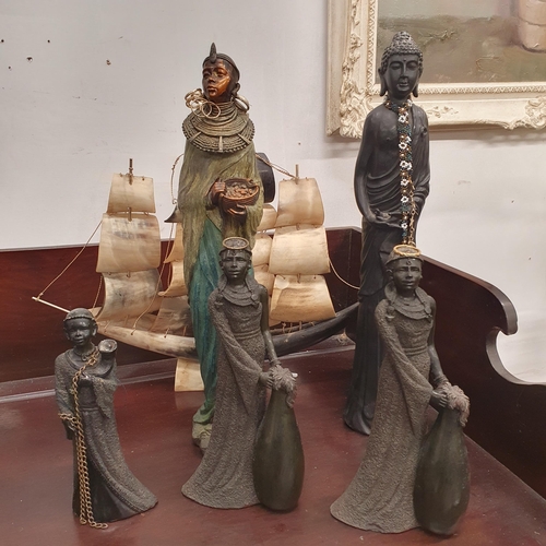 388 - A quantity of African and Asian Figures along with a bone scratch built sailing Ship in full mask.
T... 