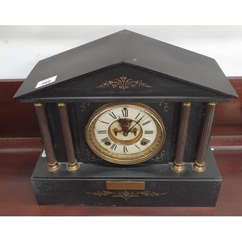 390 - A 19th Century Black Slate mantel Clock with columned front. H 34 x W 37 x D 14 cm approx.