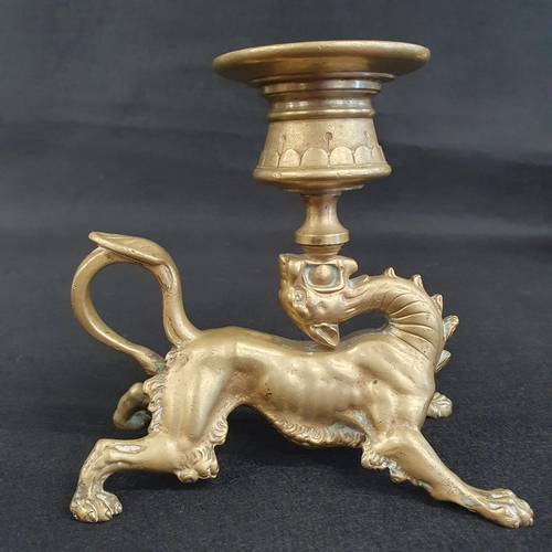 456 - A heavy 19th Century cast Brass chamber Candlestick in the form of a feline with dragon head support... 