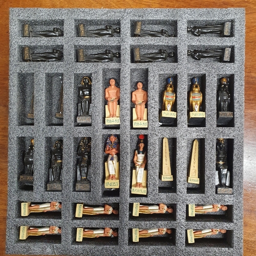 512 - An Egyptian Chess set along with a carving set and a group of Silver Plate to include two wine coast... 