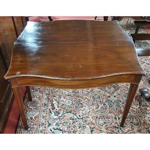 12 - An early 19th Century Mahogany serpentine fronted Foldover Tea Table with square moulded tapered sup... 