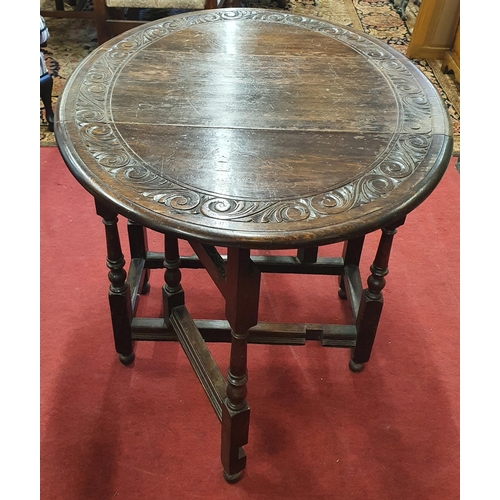 32 - A late 19th early 20th Century Oak gate legged Table on baluster-turned supports & turned feet with ... 