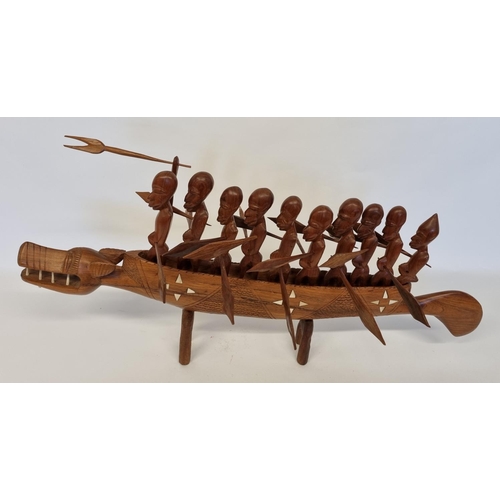 963 - A large Hardwood Polynesian style Boat with men and  bone inlay. L 93 cm approx.