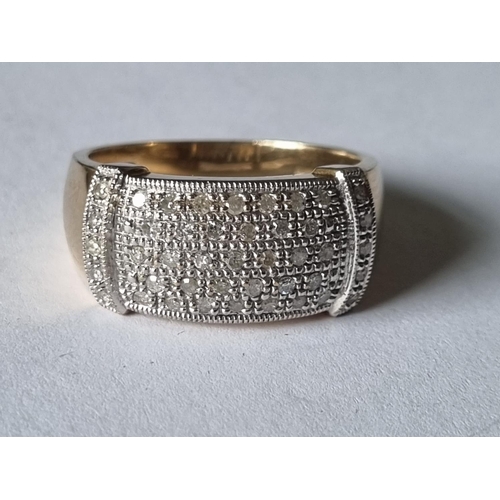 438 - A very large 9ct Gold and Diamond Ring with approx 1/2 ct of Diamonds, size Y.