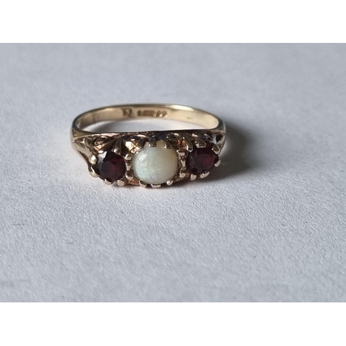 440 - A 9ct Gold, Opel and Garnet three stone Ring, size I1/2.