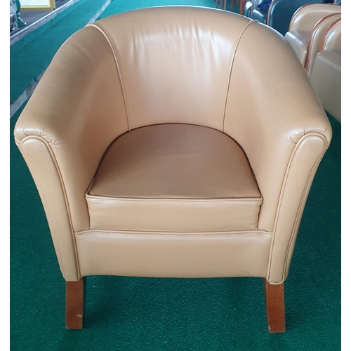 157 - A Tub chair , Tan leather effect.
H 83 x 70 x 60 , seat Height 46 cm approx.
(generic photo slight d... 