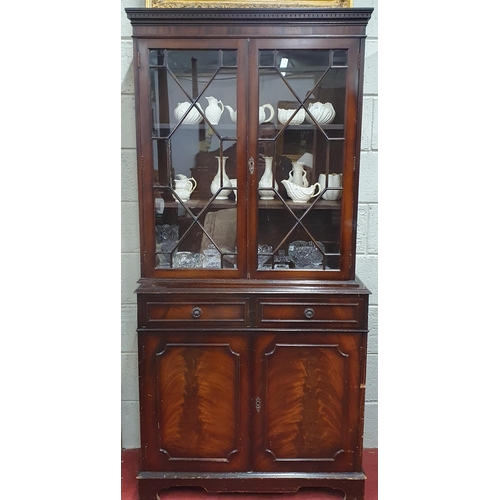 145 - A modern Mahogany Veneered two door Bookcase. H 188 x W 88 x D 40 cm approx.