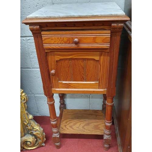 181 - A 19th Century pitch Pine Night Cupboard with white marble top with a single door and single frieze ... 