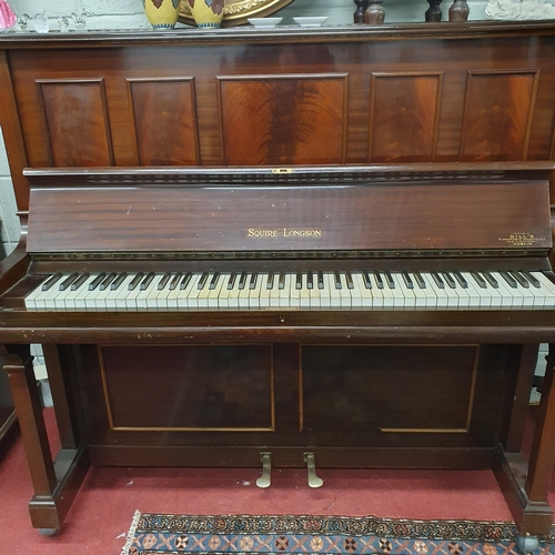 185 - A good Mahogany Veneered upright Piano by Squire Longston. H 136 x W 140 x D 67 cm approx.