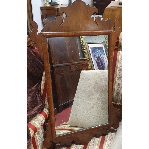 188 - A 19th Century Walnut Wall Mirror.
H 66 x W 39 cm approx.