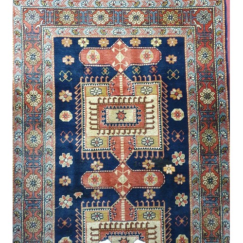 200 - A Blue ground Persian Rug with a unique medallion design. 202 x 199cm approx.