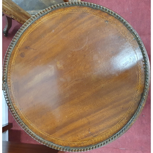 252 - A really good Edwardian Mahogany revolving Side Table on tripod supports with brass gallery top.
H 6... 