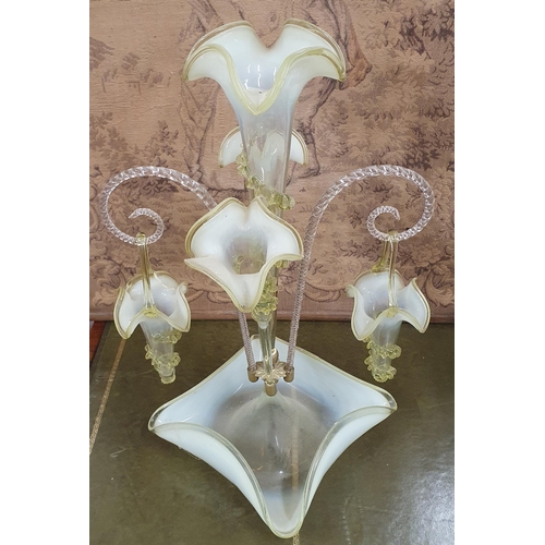 258 - A good 19th Century Vaseline three branch Glass Epergne with hanging baskets.
H 52 cm approx.