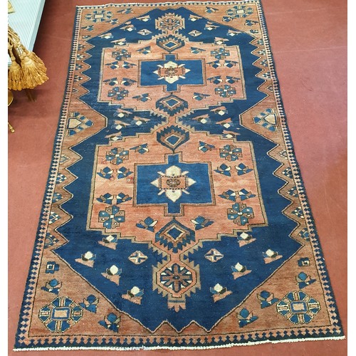 260 - A blue ground Rug with unique medallion design 283 x 158cm approx.