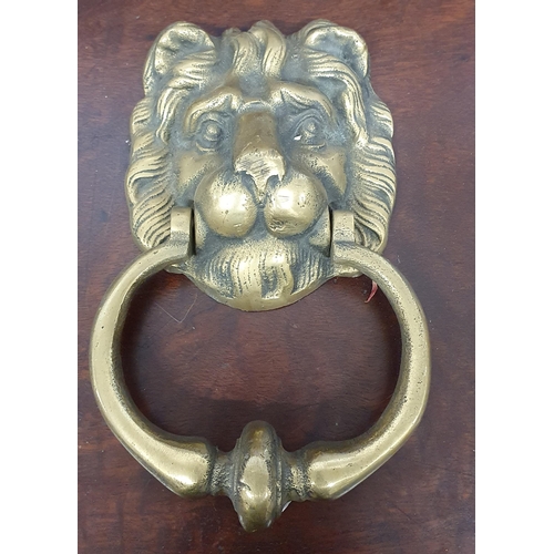 317 - A really good Brass Door Knocker along with three sets of horse brasses.