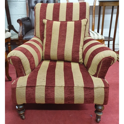 335 - A good Armchair with deep buttoned back upholstered in burgundy fabric with turned supports along wi... 