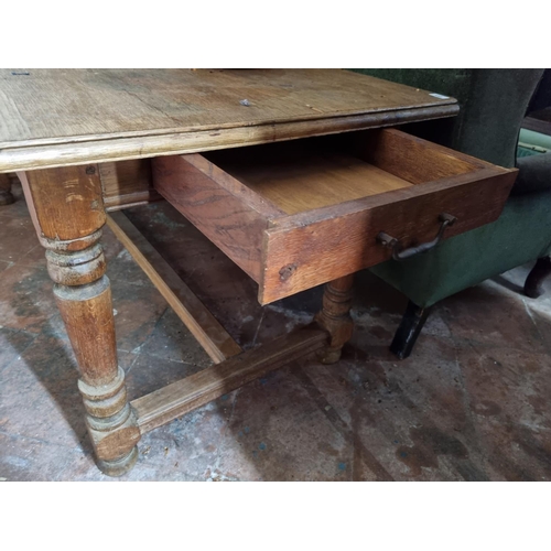 358 - A 20th Century Oak farm house Kitchen Table with veneered top, single frieze drawer on turned suppor... 