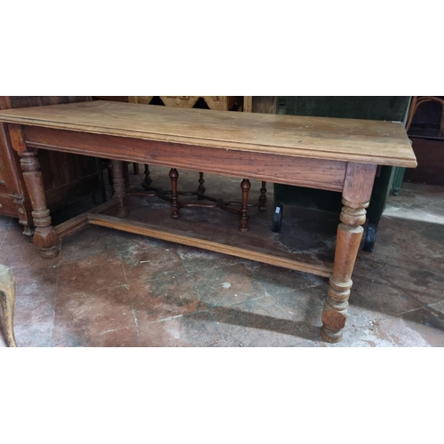 358 - A 20th Century Oak farm house Kitchen Table with veneered top, single frieze drawer on turned suppor... 