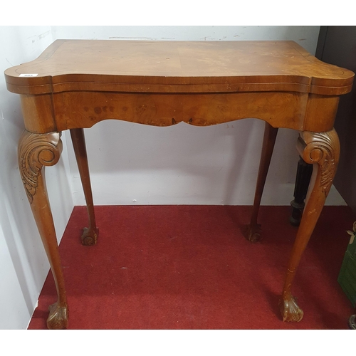 402 - A 20th Century Walnut fold over card Table on carved cabriole supports.
H 74 x W 76 x D 42 cm approx... 