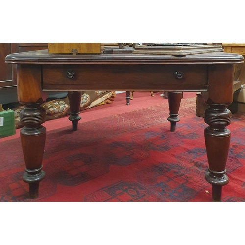 419 - A 19th Century Mahogany Dining Table of good quality on turned supports and brass casters, missing l... 