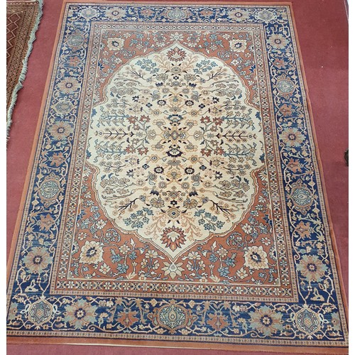 436 - A Rust ground Taj Rug with unique medallion design and multi borders.
L 240 x W 170 cm approx.