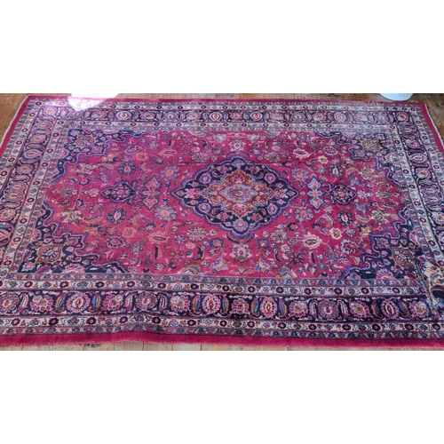 440 - A Vintage Red ground Iranian Carpet with a floral medallion design from the Masher region of Iran.  ... 