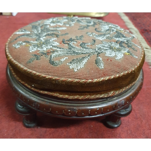 459 - A Victorian Mahogany circular Footstool with bead tapestry top om turned, fluted supports together w... 