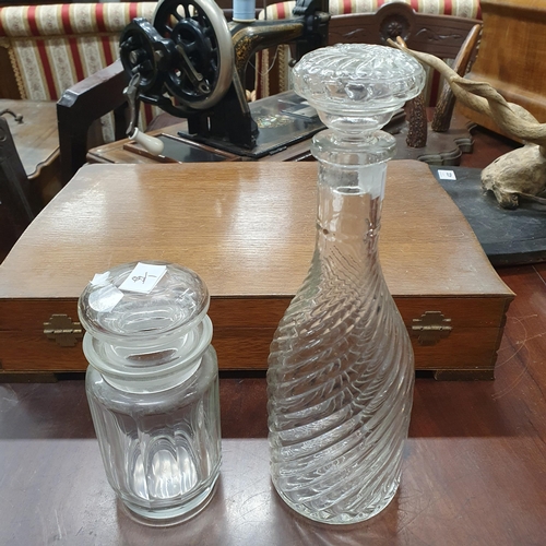 460 - Three square Decanters and one other spiral reeded Decanter together with a glass and silver plated ... 