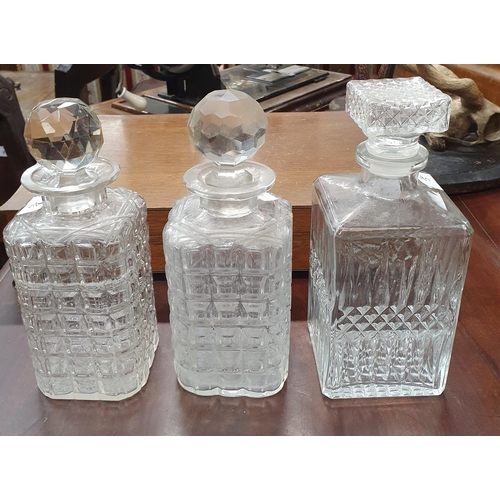 460 - Three square Decanters and one other spiral reeded Decanter together with a glass and silver plated ... 